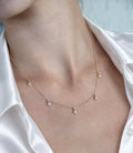 14K solid gold multi-clover lab-grown diamond necklace, model wearing white satin shirt