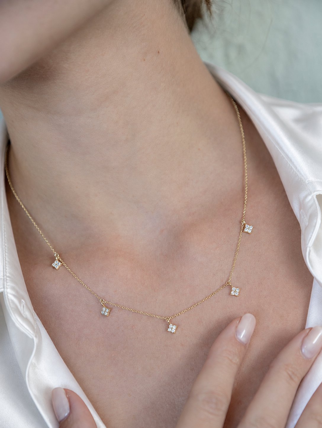 14K solid gold multi-clover lab-grown diamond necklace, model wearing white satin shirt