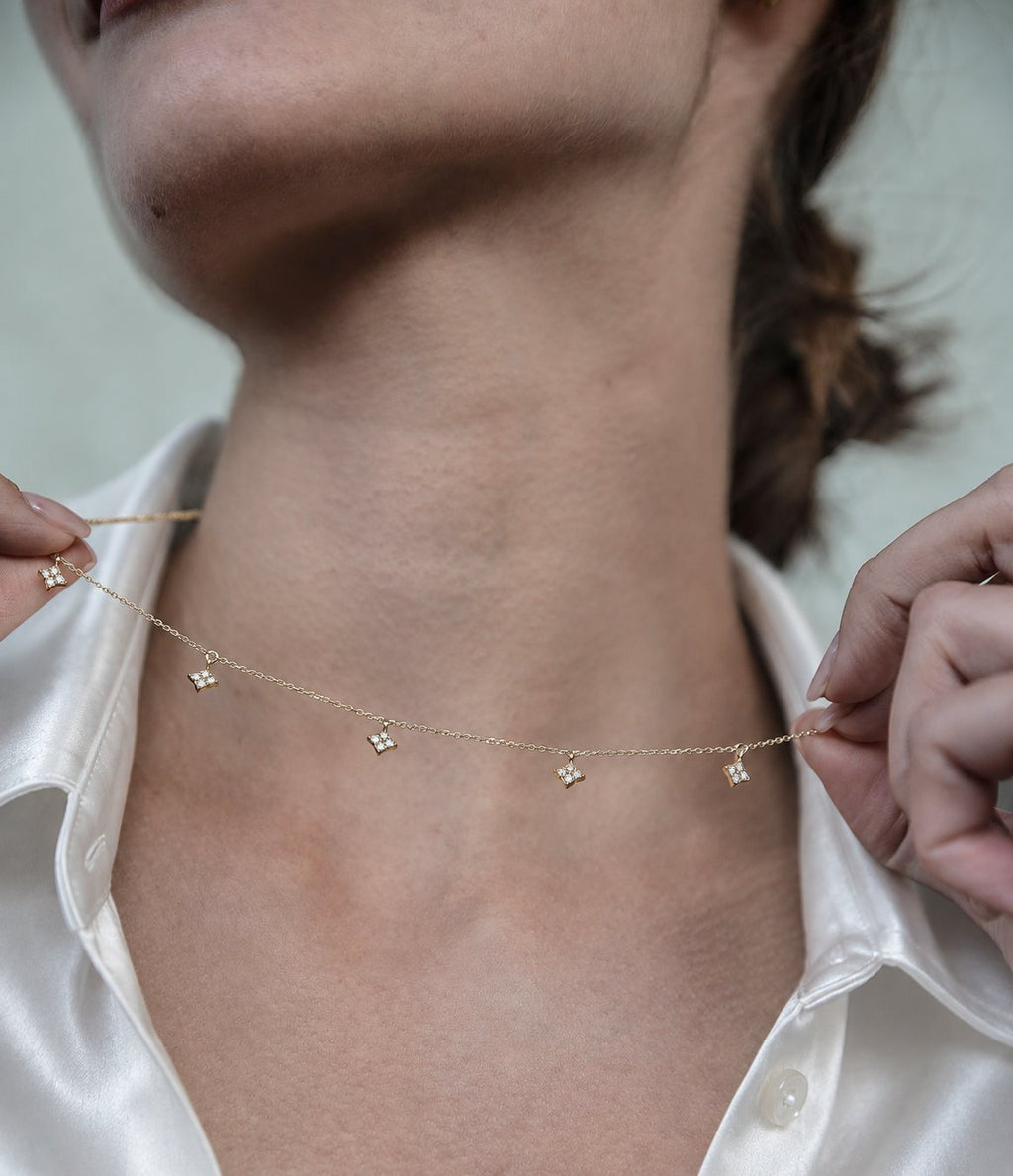 14K solid gold multi-clover lab-grown diamond necklace, model wearing white satin shirt