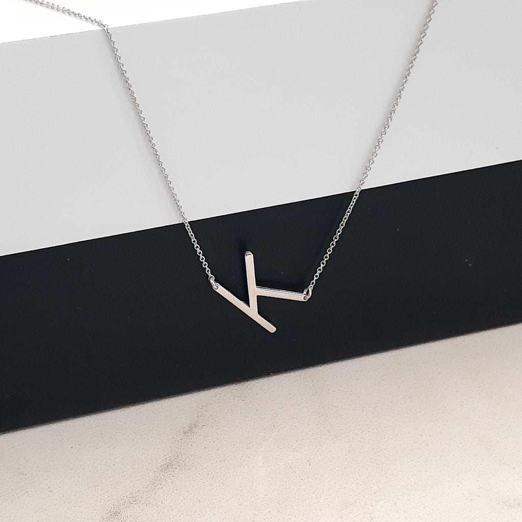 14K solid gold sideways letter necklace, styled product view