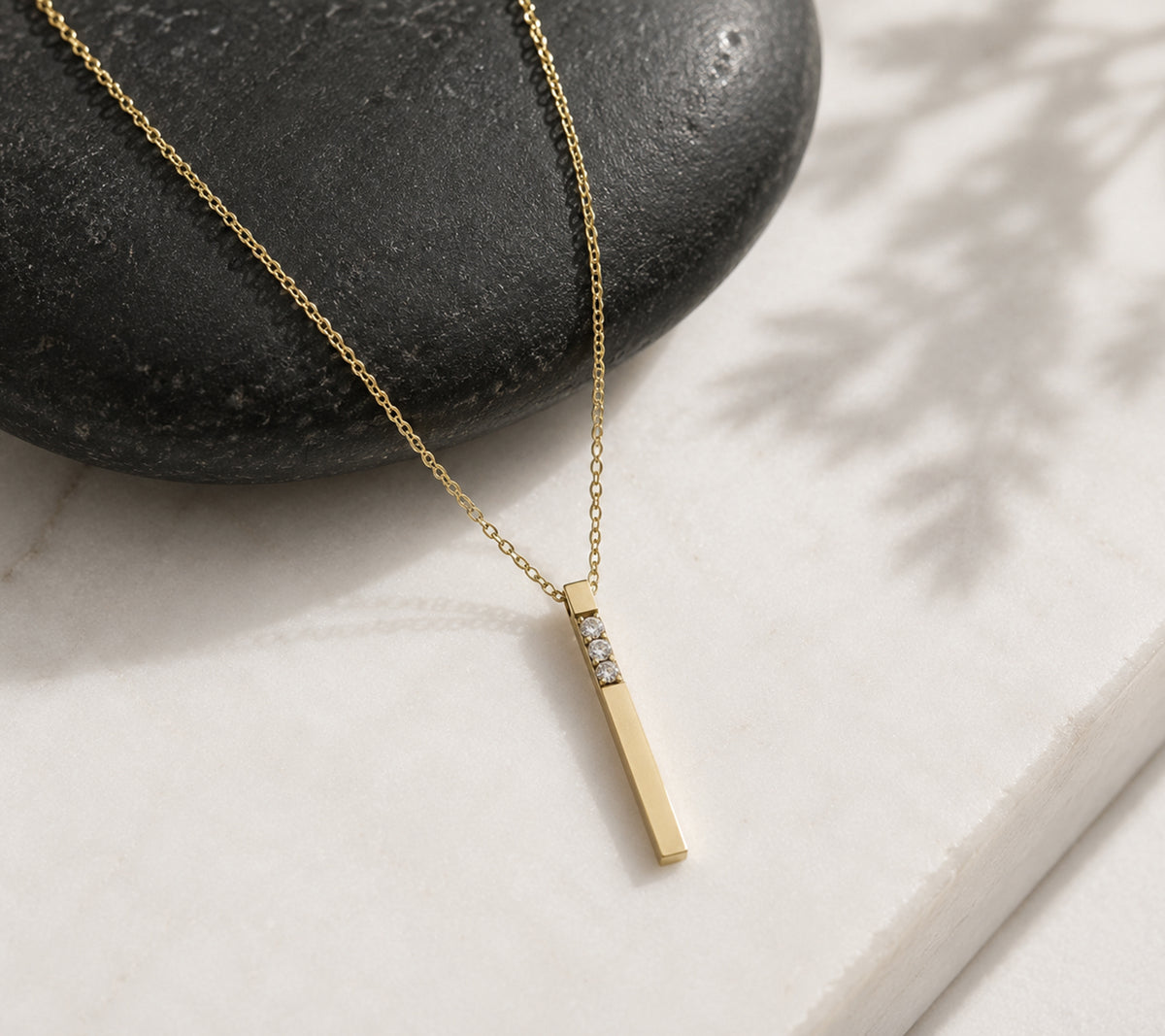 Close-up of 14K yellow gold 3D lab-grown diamond bar necklace