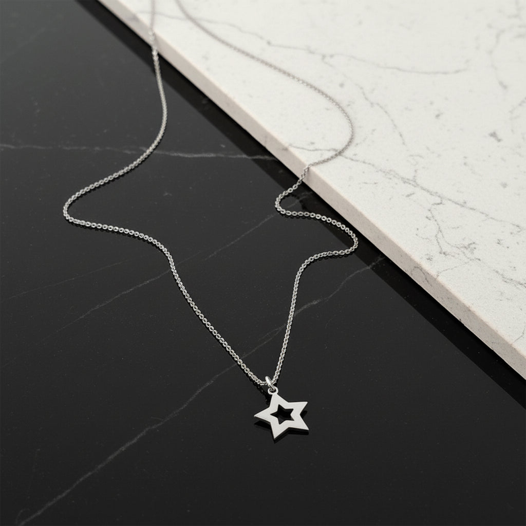 Close-up of 14K white gold star necklace