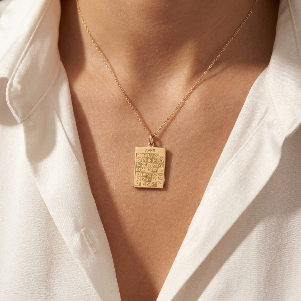 14K solid gold calendar pendant, worn at the neckline