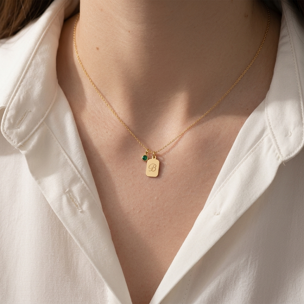 14K solid gold personalized name tag necklace with birthstone, worn at the neckline