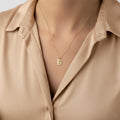 14K solid gold old english initial necklace, worn at the neckline