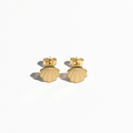 A pair of gold stud earrings shaped like scallop shells, shown on a clean white background with soft shadows.