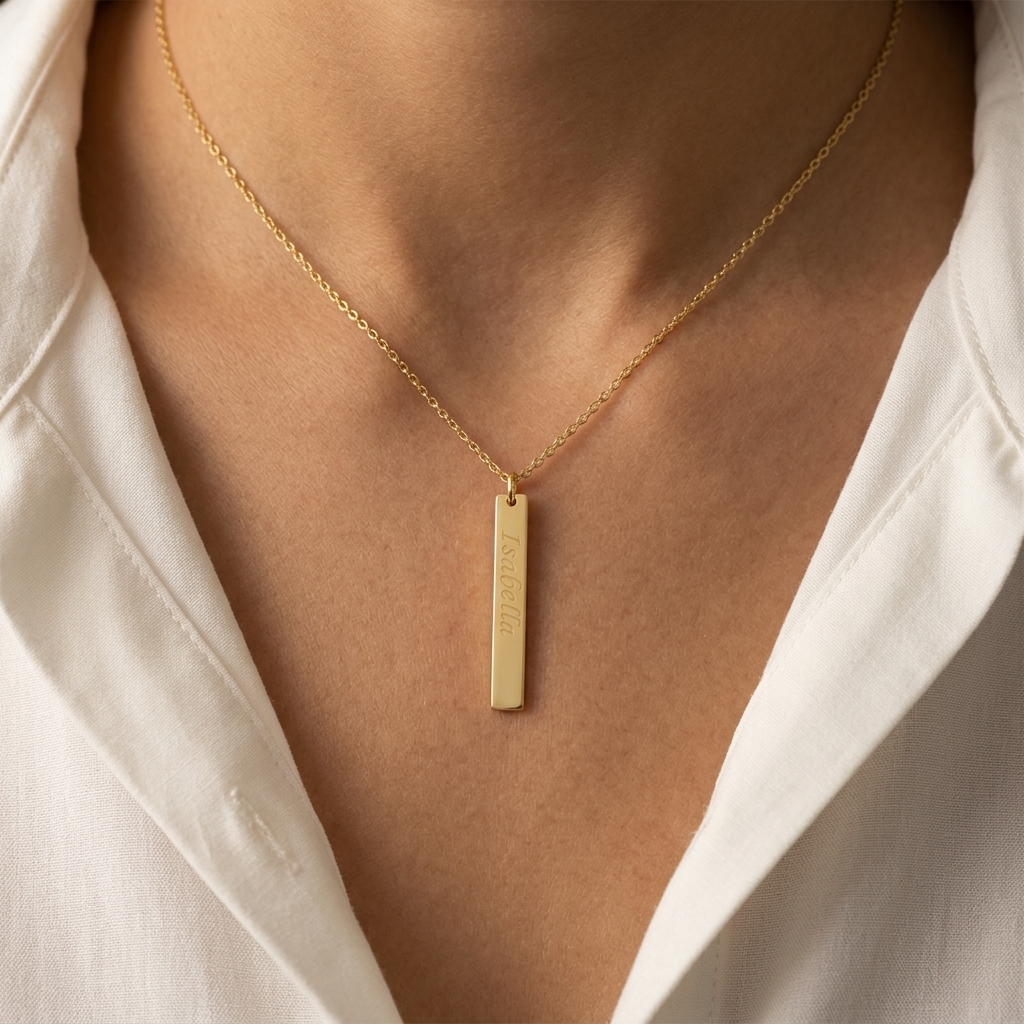 Close-up of 14K yellow gold vertical bar necklace