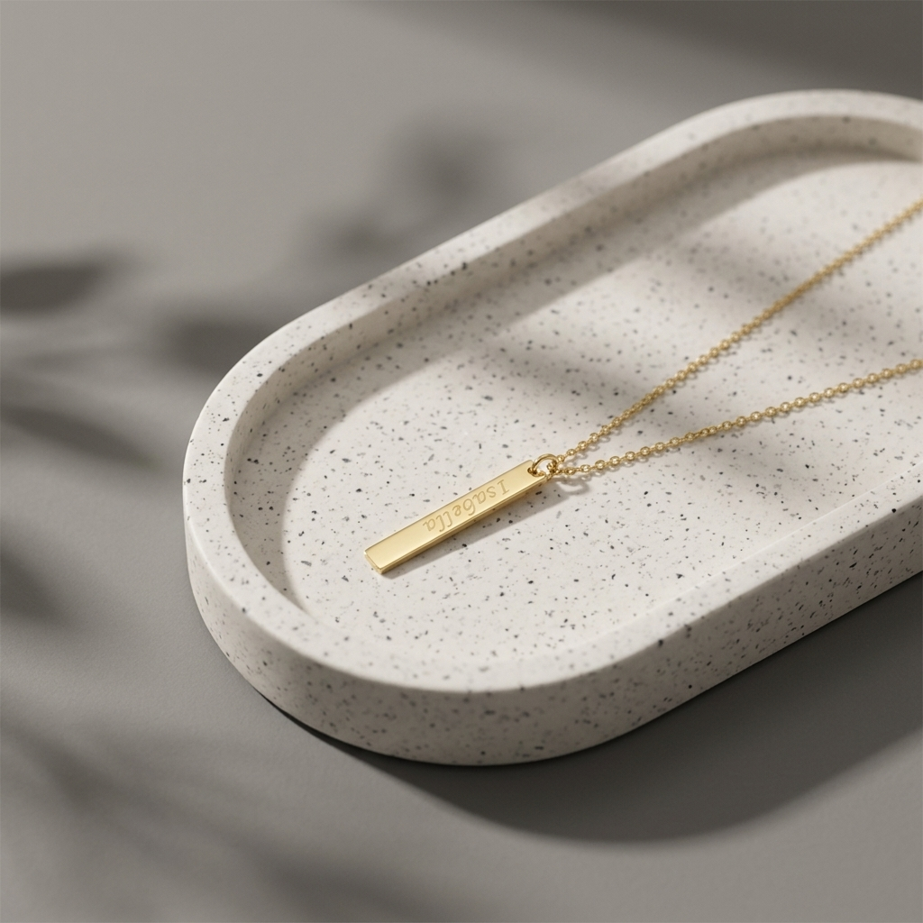 Close-up of 14K yellow gold vertical bar necklace