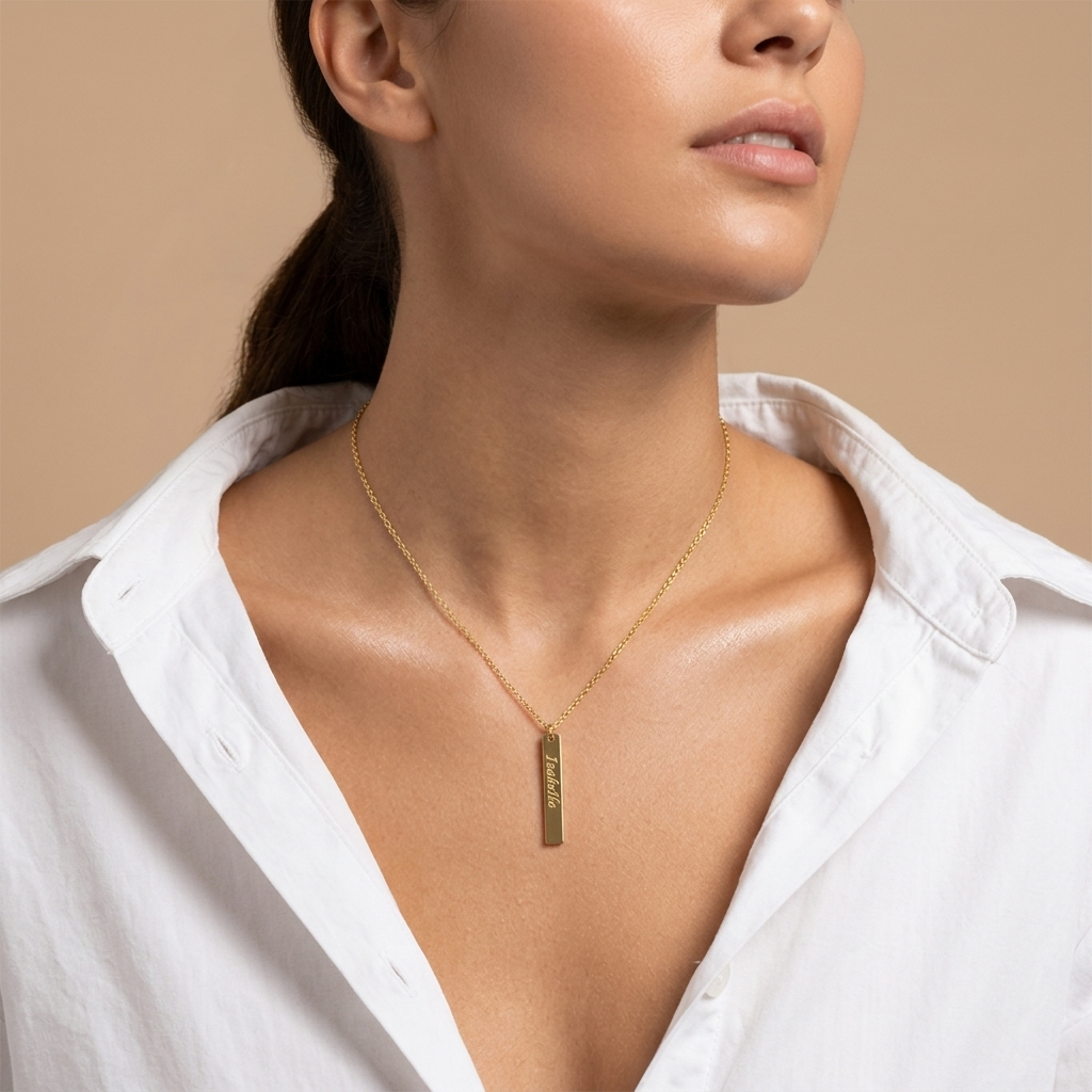 Close-up of 14K yellow gold vertical bar necklace