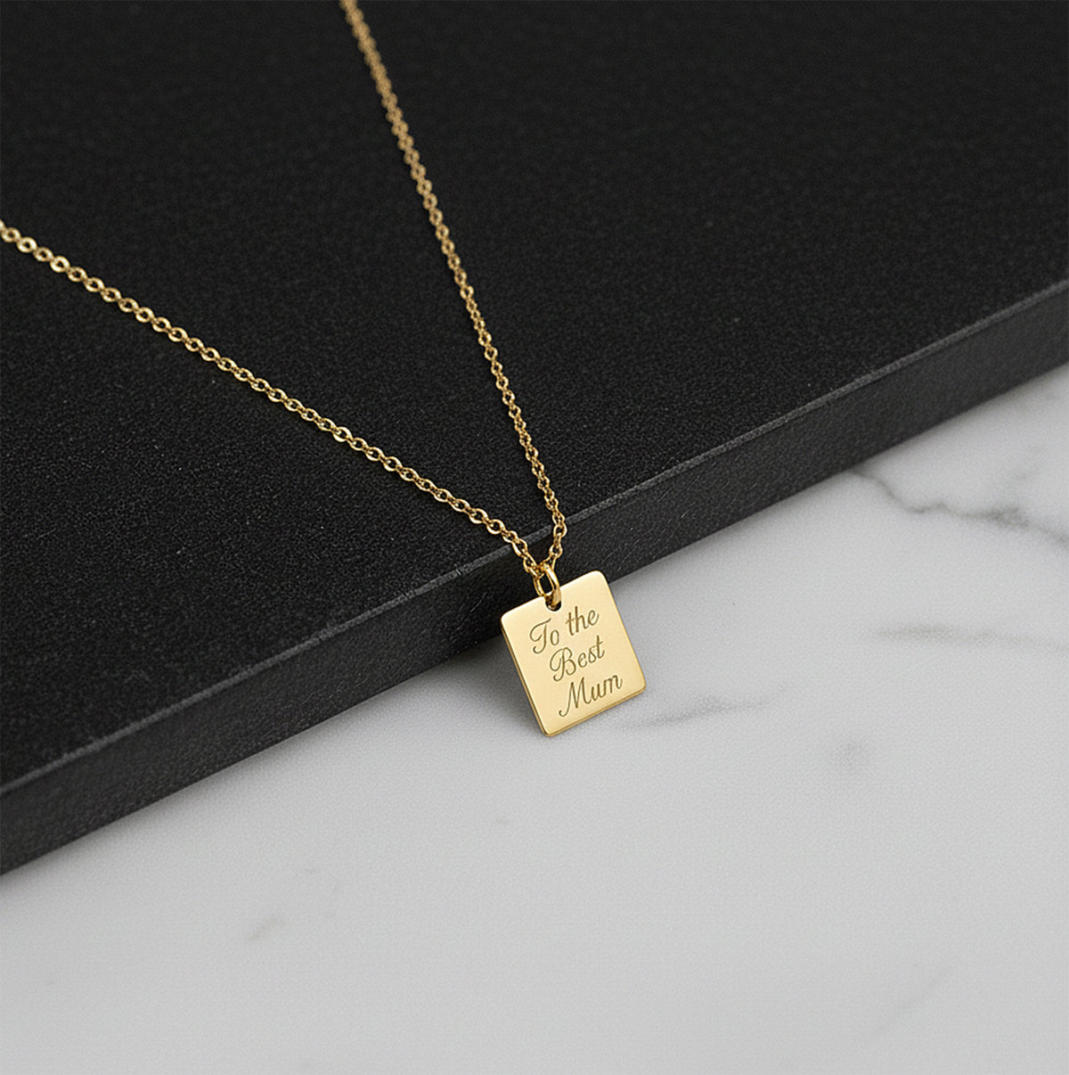 Close-up of 14K yellow gold custom initial letter necklace