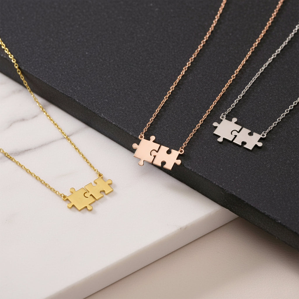 Close-up of 14K yellow gold friendship puzzle necklace
