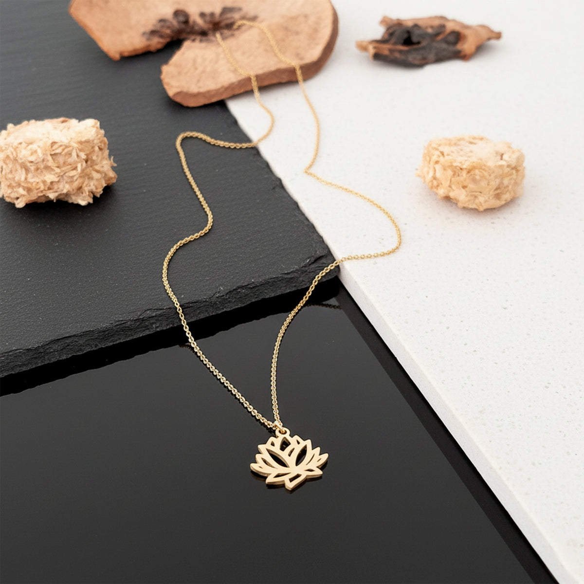 Close-up of 14K yellow gold lotus flower necklace
