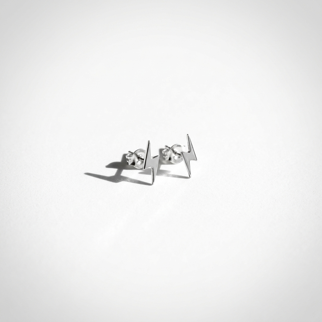 Close-up of 14K white gold everyday lightning bolt stud earrings