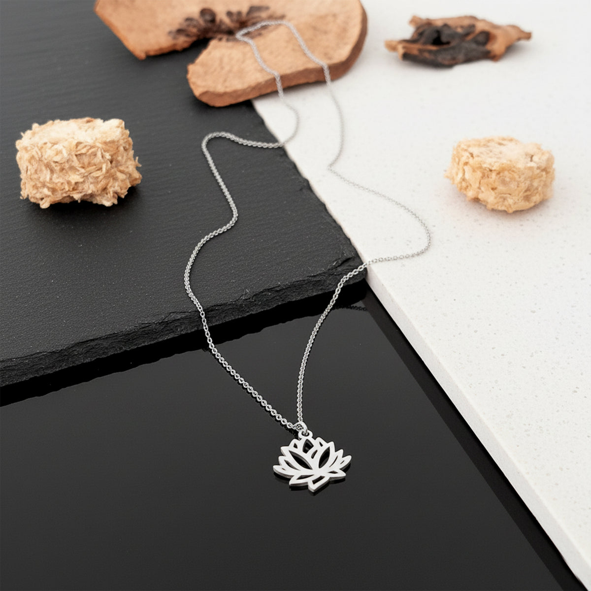 Close-up of 14K white gold lotus flower necklace