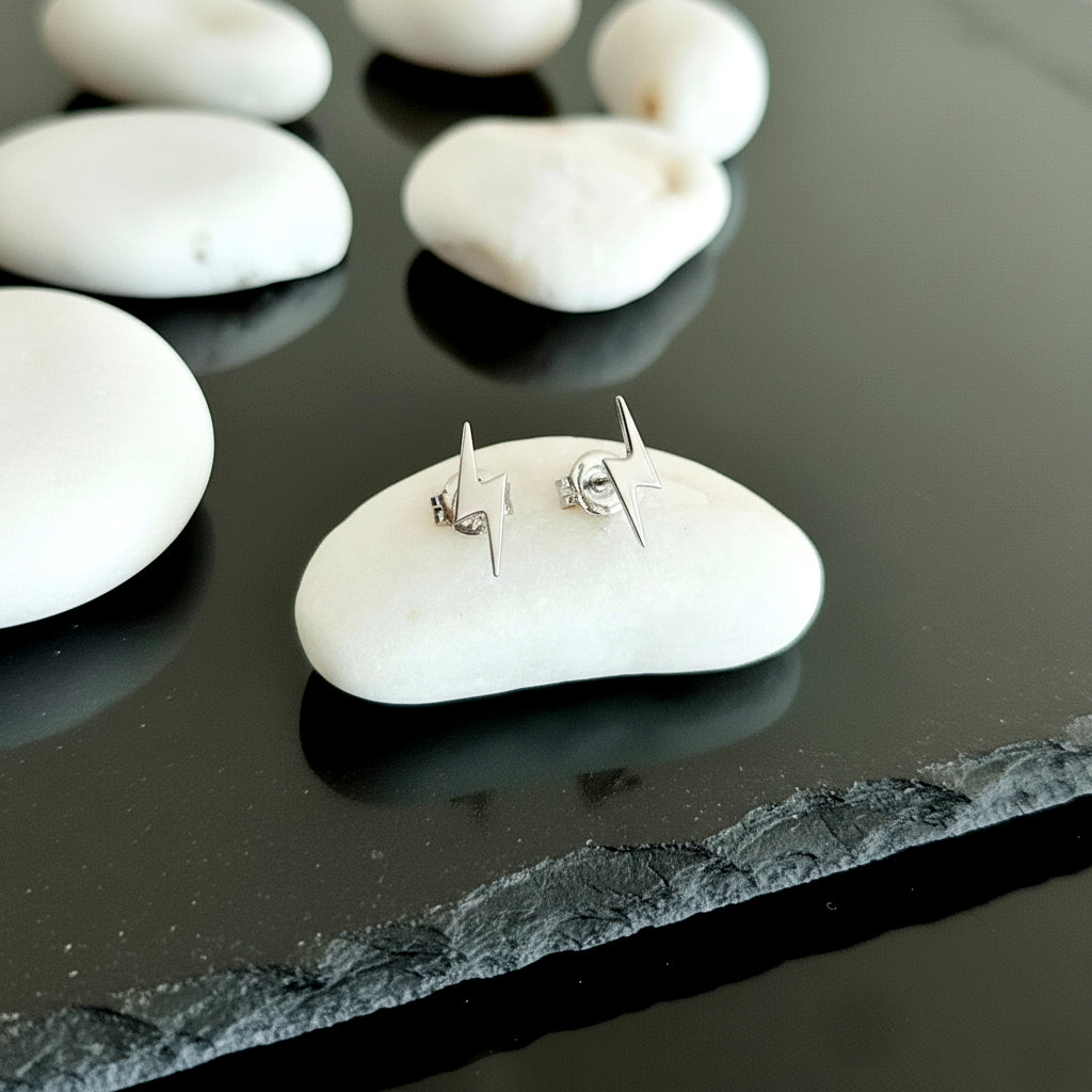 Close-up of 14K white gold everyday lightning bolt stud earrings