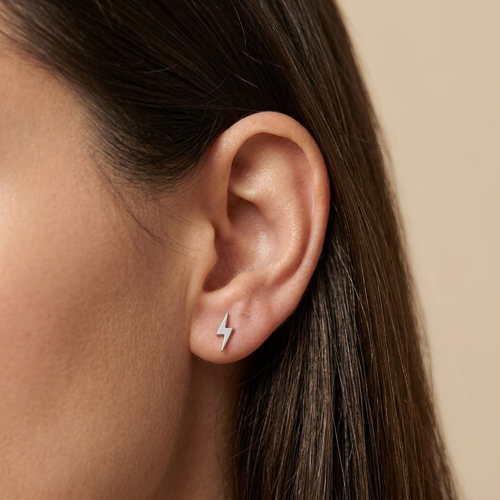 Close-up of 14K white gold everyday lightning bolt stud earrings