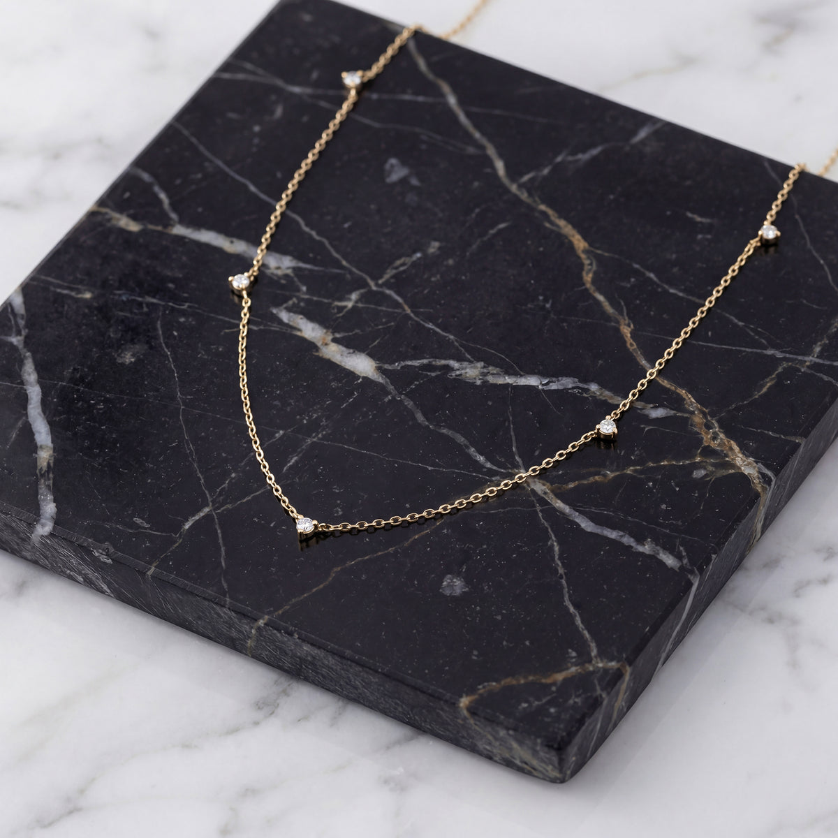Close-up of 14K yellow gold lab-grown diamond station necklace